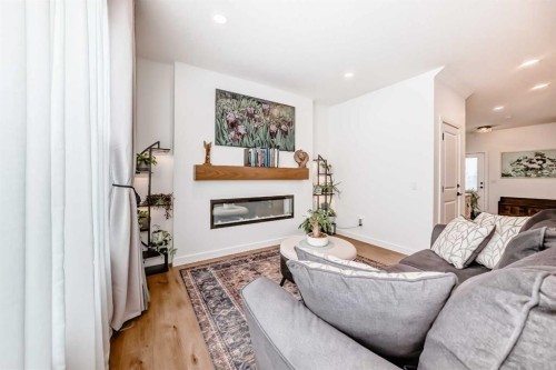32 Sugarsnap Way Se, Calgary, AB - Indoor Photo Showing Living Room With Fireplace