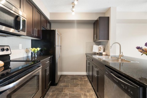 1315-81 Legacy Boulevard Se, Calgary, AB - Indoor Photo Showing Kitchen With Stainless Steel Kitchen With Double Sink