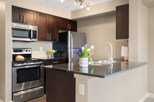 1315-81 Legacy Boulevard Se, Calgary, AB - Indoor Photo Showing Kitchen With Stainless Steel Kitchen With Double Sink With Upgraded Kitchen