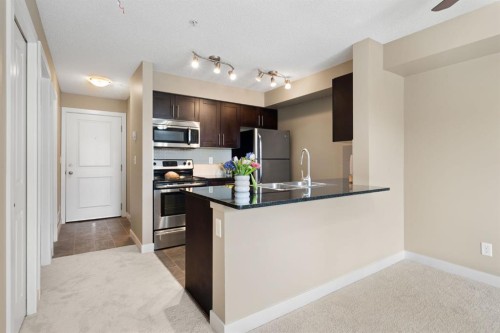 1315-81 Legacy Boulevard Se, Calgary, AB - Indoor Photo Showing Kitchen With Stainless Steel Kitchen With Double Sink