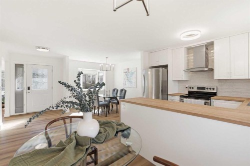 431 Queen Charlotte Drive Se, Calgary, AB - Indoor Photo Showing Other Room With Fireplace