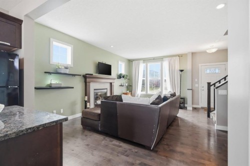 42 Sage Hill Green Nw, Calgary, AB - Indoor Photo Showing Living Room With Fireplace