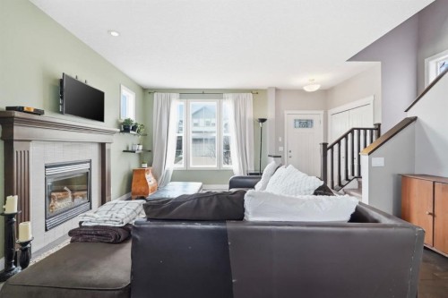 42 Sage Hill Green Nw, Calgary, AB - Indoor Photo Showing Living Room With Fireplace