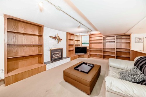 123 Varsity Estates Grove Nw, Calgary, AB - Indoor Photo Showing Living Room With Fireplace