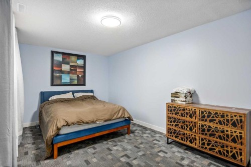 1305 10 Avenue Se, High River, AB - Indoor Photo Showing Bedroom