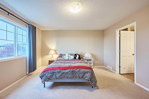 789 Panatella Boulevard Nw, Calgary, AB - Indoor Photo Showing Bedroom