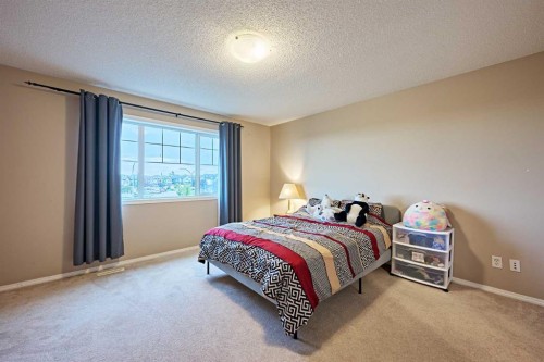 789 Panatella Boulevard Nw, Calgary, AB - Indoor Photo Showing Bedroom