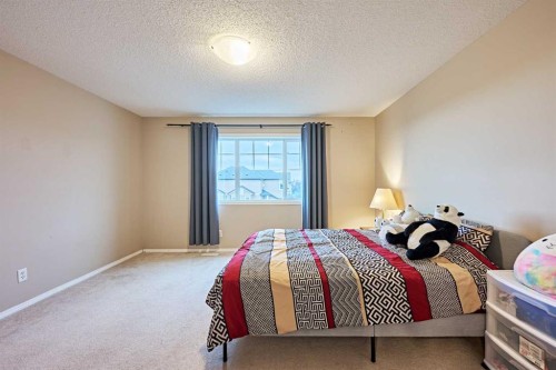 789 Panatella Boulevard Nw, Calgary, AB - Indoor Photo Showing Bedroom