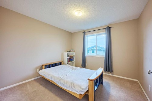 789 Panatella Boulevard Nw, Calgary, AB - Indoor Photo Showing Bedroom