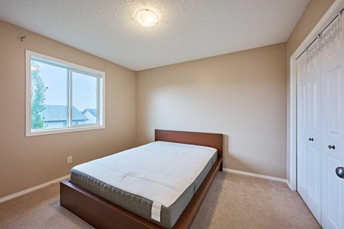 789 Panatella Boulevard Nw, Calgary, AB - Indoor Photo Showing Bedroom