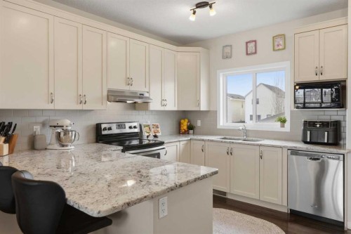2116 Reunion Square Nw, Airdrie, AB - Indoor Photo Showing Kitchen With Stainless Steel Kitchen