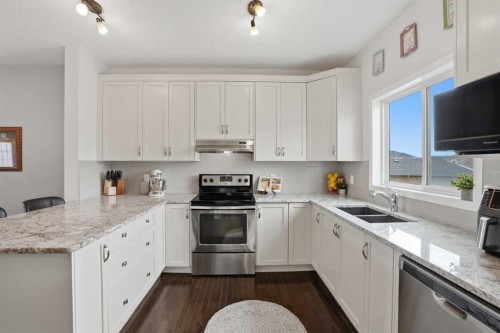2116 Reunion Square Nw, Airdrie, AB - Indoor Photo Showing Kitchen With Stainless Steel Kitchen With Double Sink With Upgraded Kitchen