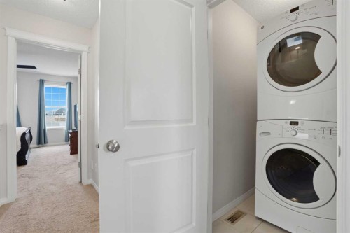 2116 Reunion Square Nw, Airdrie, AB - Indoor Photo Showing Laundry Room