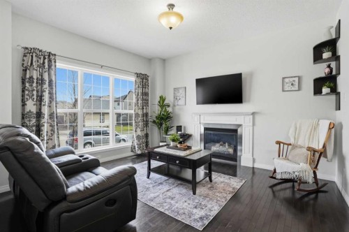2116 Reunion Square Nw, Airdrie, AB - Indoor Photo Showing Living Room With Fireplace