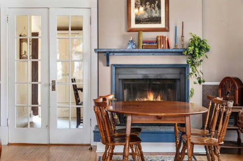 620 19 Avenue Nw, Calgary, AB - Indoor Photo Showing Dining Room With Fireplace