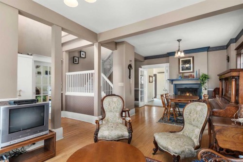 620 19 Avenue Nw, Calgary, AB - Indoor Photo Showing Living Room With Fireplace