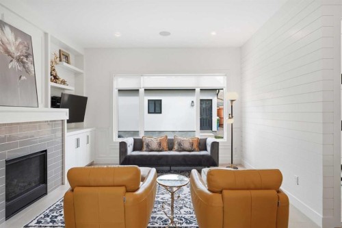 1256 Rosehill Drive Nw, Calgary, AB - Indoor Photo Showing Living Room With Fireplace