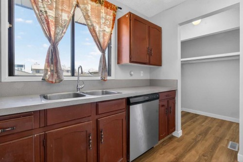 900 Abbeydale Drive Ne, Calgary, AB - Indoor Photo Showing Kitchen With Double Sink
