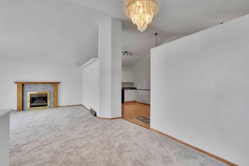 90 Martinridge Crescent Ne, Calgary, AB - Indoor With Fireplace