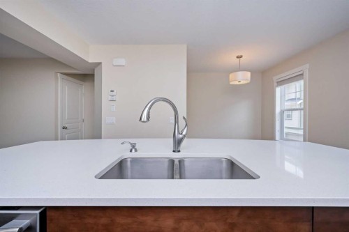 211 Mckenzie Towne Square Se, Calgary, AB - Indoor Photo Showing Kitchen With Double Sink