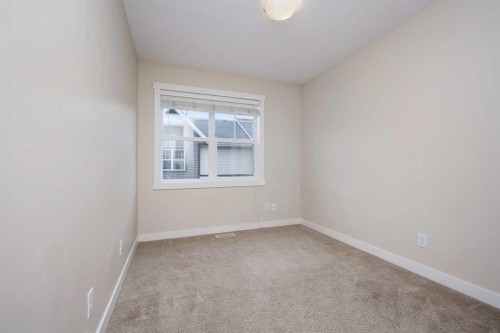 211 Mckenzie Towne Square Se, Calgary, AB - Indoor Photo Showing Other Room