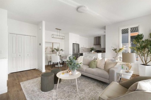 304-255 Rowmont Boulevard Nw, Calgary, AB - Indoor Photo Showing Living Room