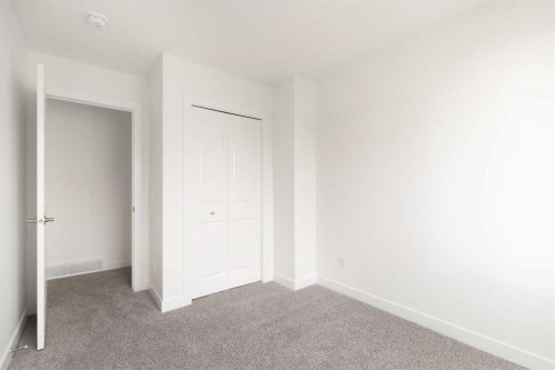 304-255 Rowmont Boulevard Nw, Calgary, AB - Indoor Photo Showing Other Room