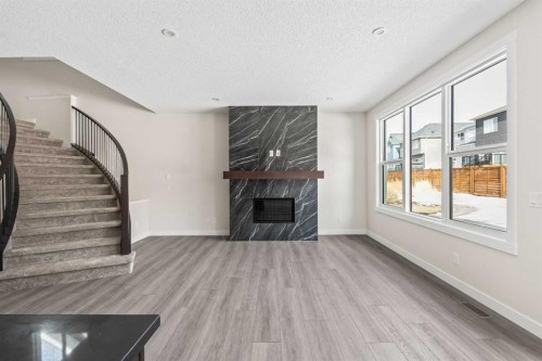 506 Lucas Way Nw, Calgary, AB - Indoor With Fireplace