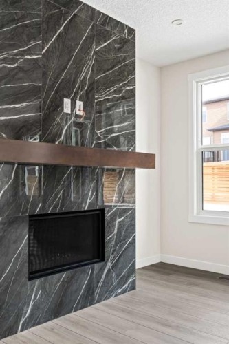 506 Lucas Way Nw, Calgary, AB - Indoor With Fireplace