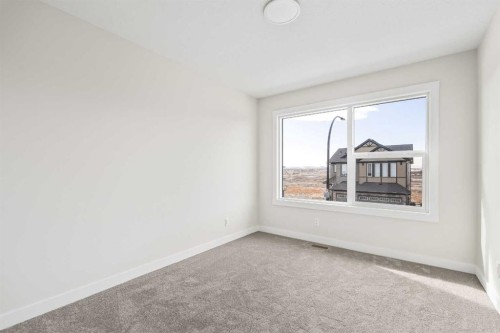 506 Lucas Way Nw, Calgary, AB - Indoor Photo Showing Other Room