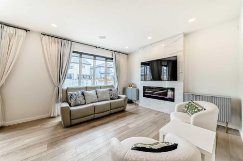164 Magnolia Terrace Se, Calgary, AB - Indoor Photo Showing Living Room With Fireplace