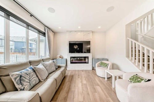 164 Magnolia Terrace Se, Calgary, AB - Indoor Photo Showing Living Room With Fireplace
