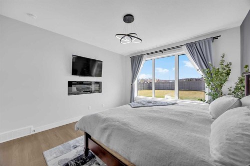 25 Cimarron Estates Gate, Okotoks, AB - Indoor Photo Showing Bedroom