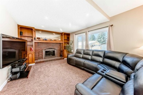 127 Mckerrell Way Se, Calgary, AB - Indoor Photo Showing Living Room With Fireplace