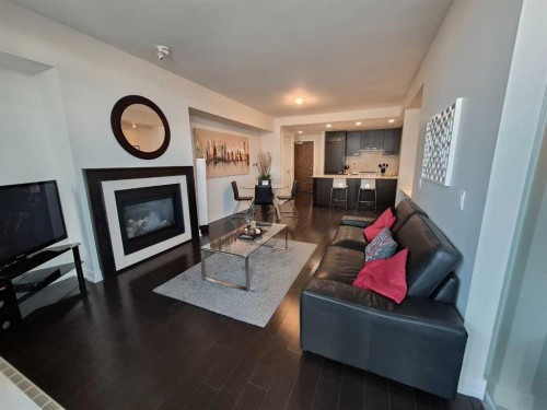 722-222 Riverfront Avenue Sw, Calgary, AB - Indoor Photo Showing Living Room With Fireplace