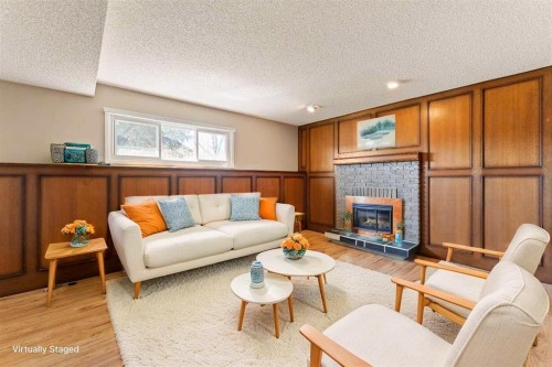 7003 Temple Drive Ne, Calgary, AB - Indoor Photo Showing Living Room With Fireplace