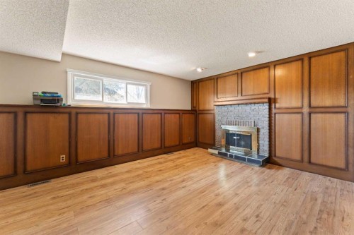 7003 Temple Drive Ne, Calgary, AB - Indoor With Fireplace