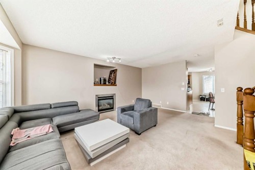 111 Tarawood Road Ne, Calgary, AB - Indoor Photo Showing Living Room With Fireplace