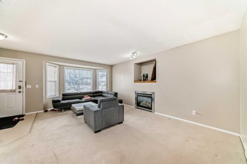 111 Tarawood Road Ne, Calgary, AB - Indoor Photo Showing Living Room With Fireplace