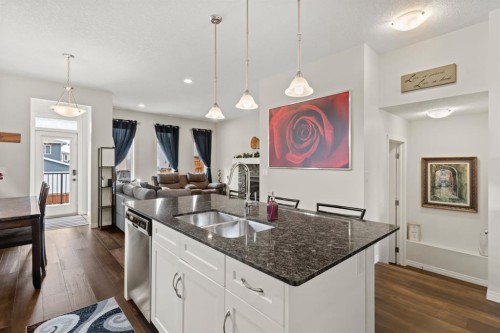 27 Heritage Rise, Cochrane, AB - Indoor Photo Showing Kitchen With Double Sink With Upgraded Kitchen