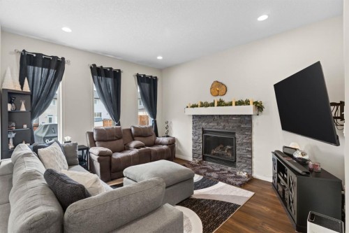 27 Heritage Rise, Cochrane, AB - Indoor Photo Showing Living Room With Fireplace