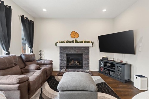 27 Heritage Rise, Cochrane, AB - Indoor Photo Showing Living Room With Fireplace