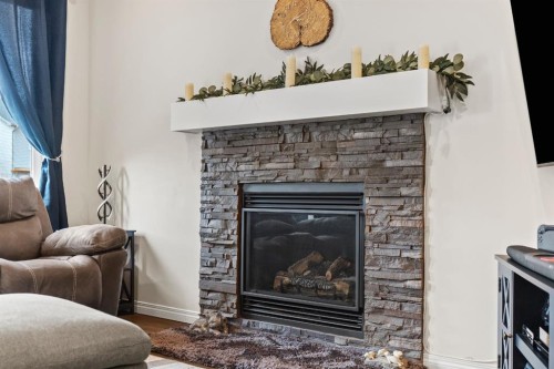 27 Heritage Rise, Cochrane, AB - Indoor Photo Showing Living Room With Fireplace