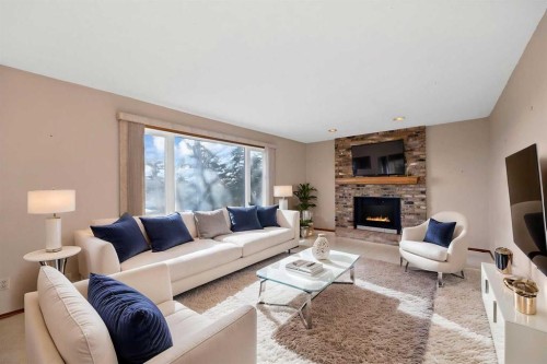 68 Hawkfield Crescent Nw, Calgary, AB - Indoor Photo Showing Living Room With Fireplace