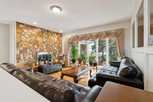7 Willow Vale, Rural Rocky View County, AB - Indoor Photo Showing Living Room With Fireplace