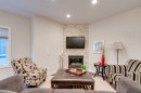 2-309 15 Avenue Ne, Calgary, AB  - Indoor Photo Showing Living Room With Fireplace 