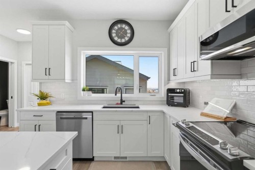 120 Treeline Manor Sw, Calgary, AB - Indoor Photo Showing Kitchen With Stainless Steel Kitchen With Upgraded Kitchen