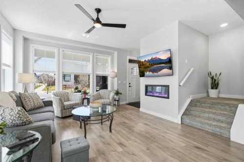 120 Treeline Manor Sw, Calgary, AB - Indoor Photo Showing Living Room With Fireplace