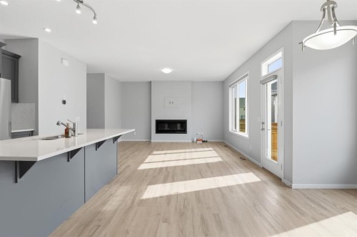 93 Cityline Square Ne, Calgary, AB - Indoor Photo Showing Kitchen With Fireplace