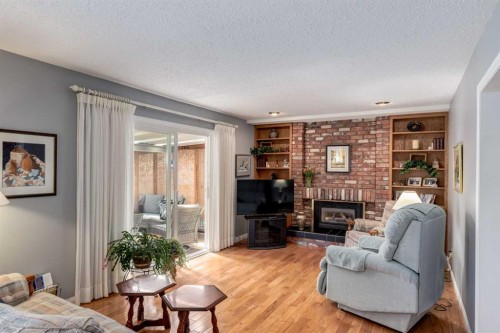 107 Valhalla Crescent Nw, Calgary, AB - Indoor Photo Showing Living Room With Fireplace
